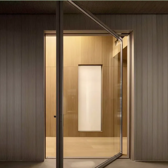 Ultra slim aluminium pivot door with minimal frame in modern architectural setting